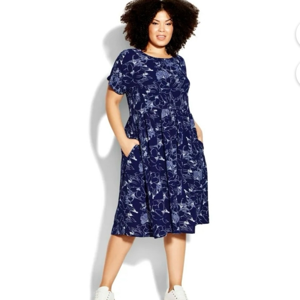 . Women’s plus size doll print up dress. Comes with pockets. NWT
